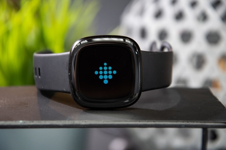 how to put your own picture on fitbit versa